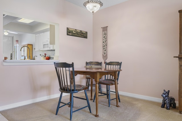 4215 Gator Trace Ave Unit I, Fort Pierce, FL 34950 - dining space featuring light colored carpet and ceiling fan