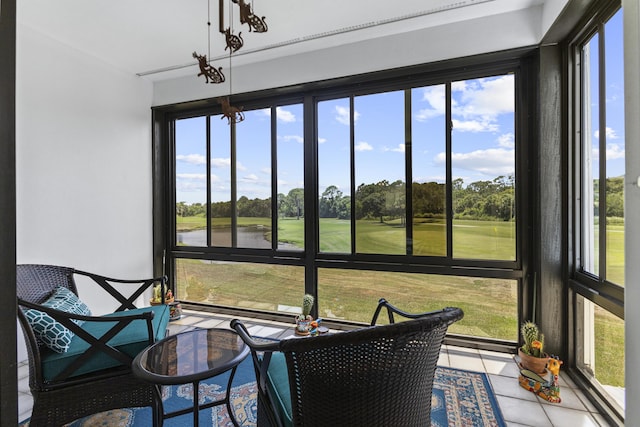 4215 Gator Trace Ave Unit I, Fort Pierce, FL 34950 - sunroom with view of golf course, a water view, and view of wooded area