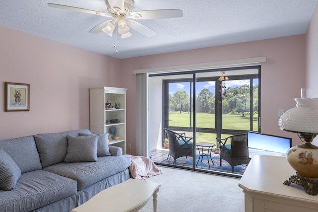 4215 Gator Trace Ave Unit I, Fort Pierce, FL 34950 - living area with carpet, a ceiling fan, and a textured ceiling