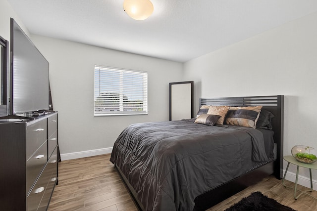 3004 N Evergreen Cir, Boynton Beach, FL 33426 - bedroom featuring baseboards and wood finished floors