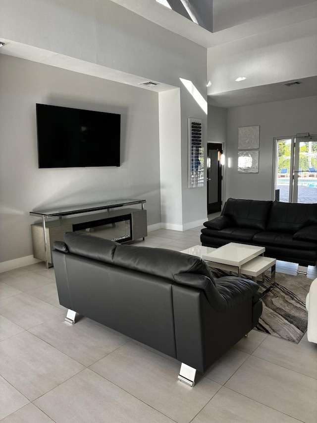 3004 N Evergreen Cir, Boynton Beach, FL 33426 - living area featuring baseboards and light tile patterned floors