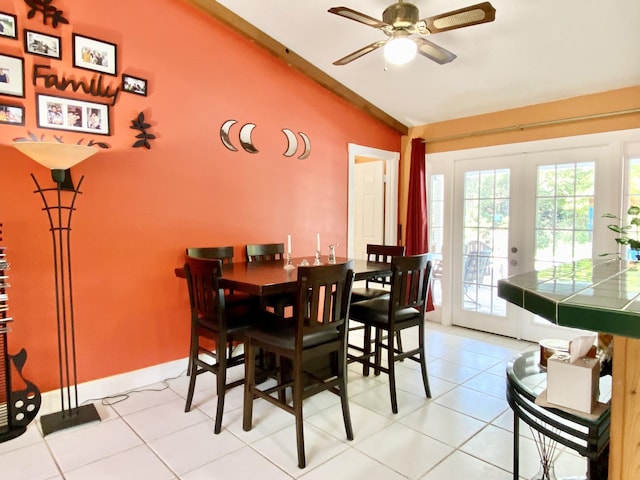 16651 96th Ter N, Jupiter, FL 33478 - dining area featuring lofted ceiling, french doors, a ceiling fan, and light tile patterned floors