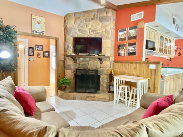 16651 96th Ter N, Jupiter, FL 33478 - living room with tile patterned floors and a stone fireplace