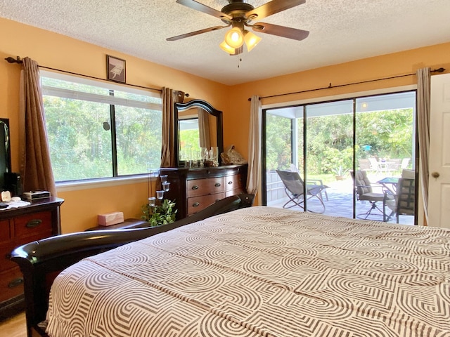 16651 96th Ter N, Jupiter, FL 33478 - bedroom featuring access to outside and a textured ceiling