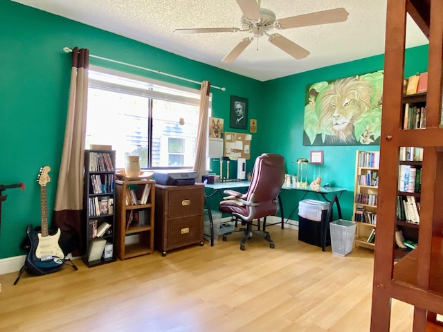 16651 96th Ter N, Jupiter, FL 33478 - office space with wood finished floors, a textured ceiling, and a ceiling fan