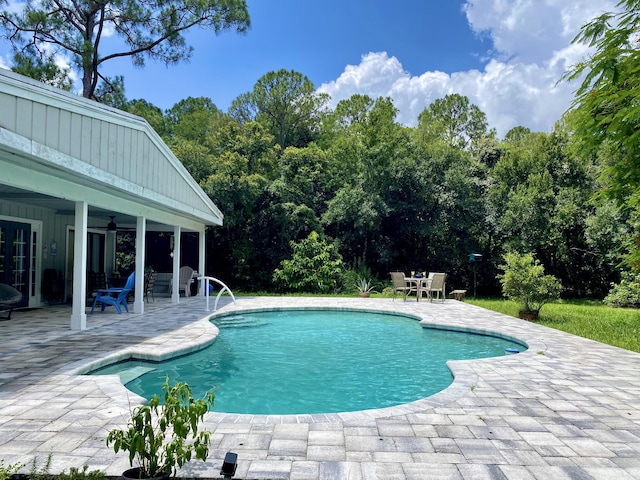 16651 96th Ter N, Jupiter, FL 33478 - swimming pool with a patio and ceiling fan