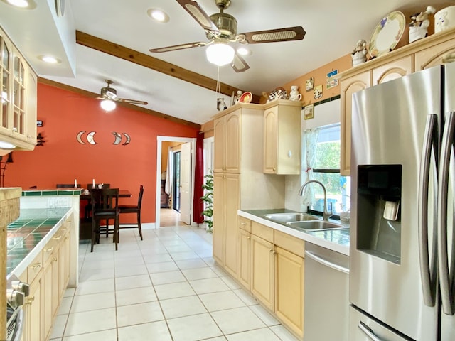 16651 96th Ter N, Jupiter, FL 33478 - kitchen with appliances with stainless steel finishes, tile counters, a ceiling fan, glass insert cabinets, and light tile patterned floors