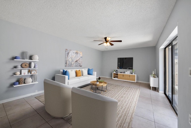 2897 SW 22nd Cir Unit 44B, Delray Beach, FL 33445 - living room featuring tile patterned floors, ceiling fan, and a textured ceiling