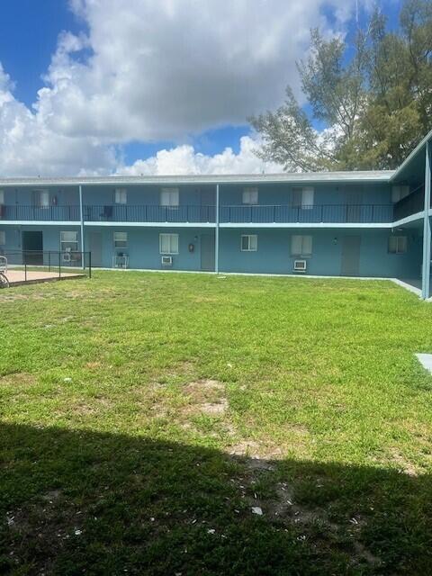 1829 N A St Unit 74, Lake Worth, FL 33460 - back of property with a lawn