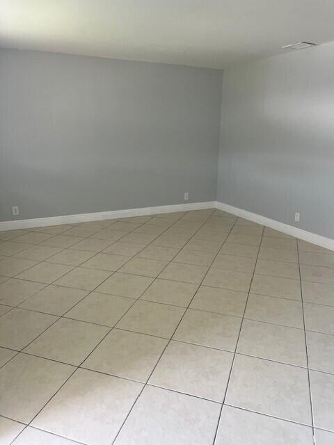 1829 N A St Unit 74, Lake Worth, FL 33460 - unfurnished room with light tile patterned floors
