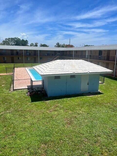 1829 N A St Unit 74, Lake Worth, FL 33460 - rear view of property with a yard