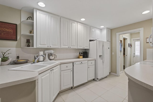 3032 W Community Dr, Jupiter, FL 33458 - kitchen featuring white appliances, white cabinets, light countertops, tasteful backsplash, and recessed lighting