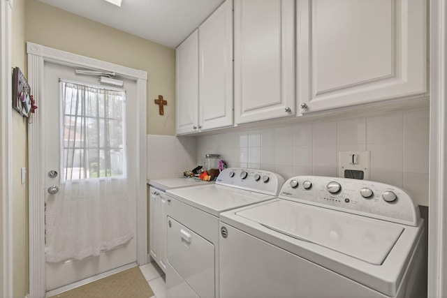 3032 W Community Dr, Jupiter, FL 33458 - laundry area with cabinet space and washer and dryer