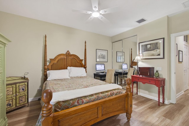 3032 W Community Dr, Jupiter, FL 33458 - bedroom with wood finished floors, a closet, and ceiling fan