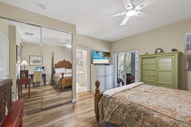 3032 W Community Dr, Jupiter, FL 33458 - bedroom featuring light wood finished floors, access to exterior, ceiling fan, and connected bathroom