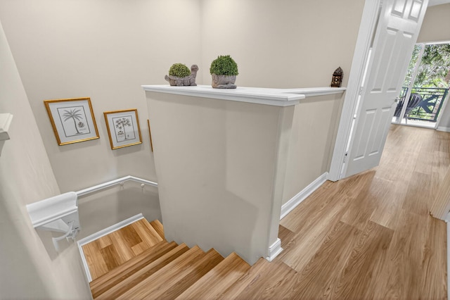 3032 W Community Dr, Jupiter, FL 33458 - stairway with wood finished floors and baseboards