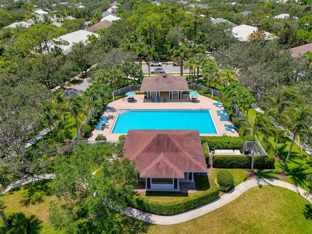 3032 W Community Dr, Jupiter, FL 33458 - view from above of property with a pool and a tree filled landscape