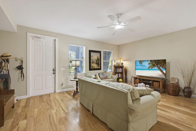 3032 W Community Dr, Jupiter, FL 33458 - living room featuring light wood-style floors and a ceiling fan
