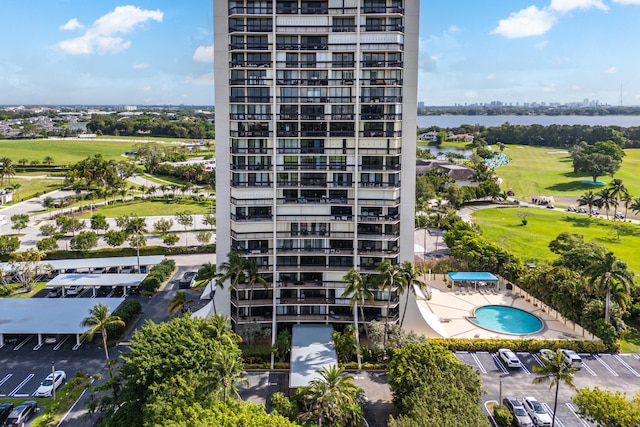 2400 Presidential Way Unit 903, West Palm Beach, FL 33401 - view of apartment building / complex featuring view of golf course, a water view, and uncovered parking