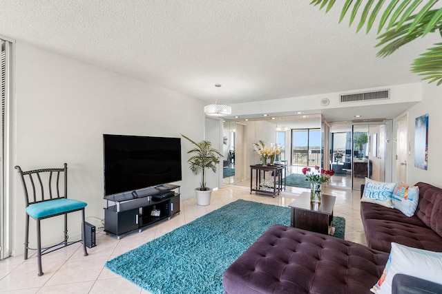 2400 Presidential Way Unit 903, West Palm Beach, FL 33401 - tiled living area with a textured ceiling