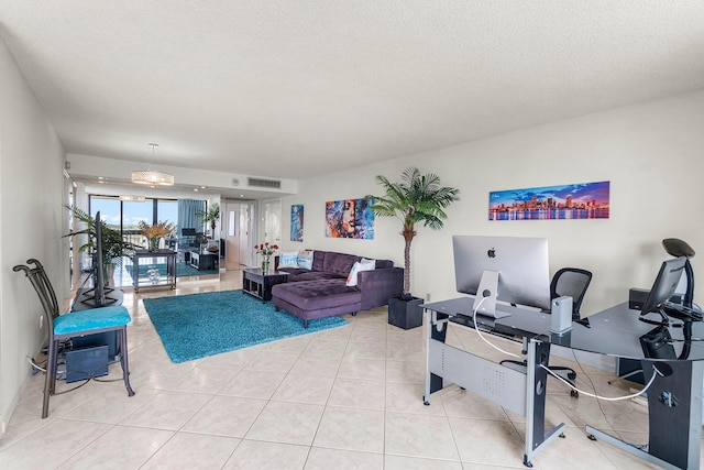 2400 Presidential Way Unit 903, West Palm Beach, FL 33401 - living room with a desk, a textured ceiling, and tile patterned floors