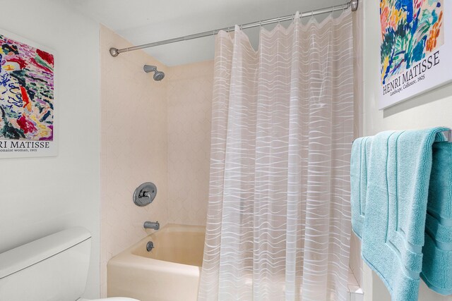 2400 Presidential Way Unit 903, West Palm Beach, FL 33401 - bathroom featuring shower / bath combo with shower curtain and toilet