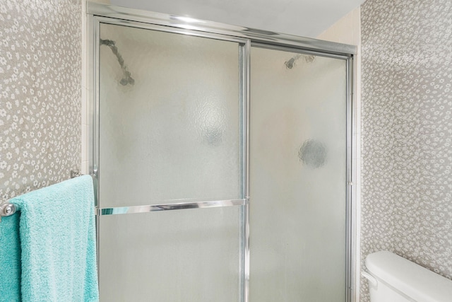 2400 Presidential Way Unit 903, West Palm Beach, FL 33401 - full bathroom with wallpapered walls and a shower with door