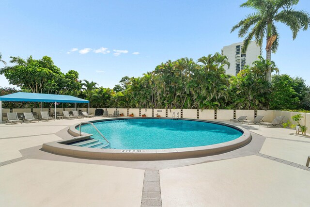 2400 Presidential Way Unit 903, West Palm Beach, FL 33401 - community pool with a patio