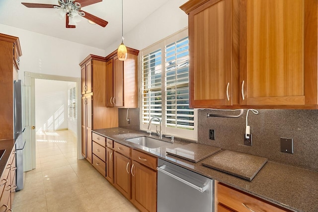 2619 SW Greenwich Way, Palm City, FL 34990 - kitchen with appliances with stainless steel finishes, ceiling fan, dark stone counters, and decorative backsplash