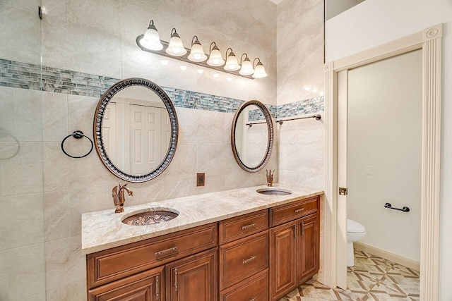 2619 SW Greenwich Way, Palm City, FL 34990 - full bath featuring double vanity, tile walls, and backsplash