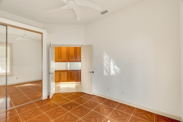 2619 SW Greenwich Way, Palm City, FL 34990 - unfurnished bedroom with a closet and ceiling fan