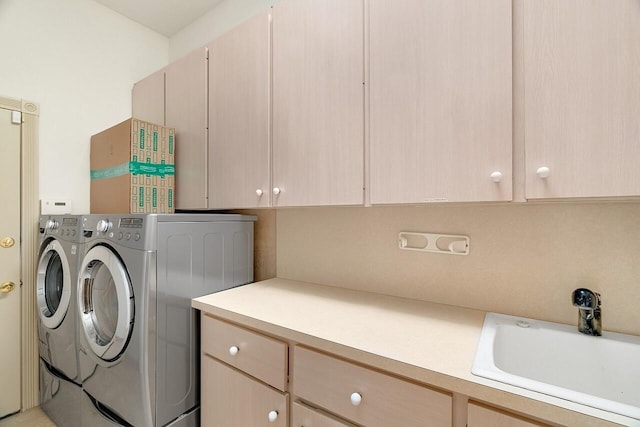 2619 SW Greenwich Way, Palm City, FL 34990 - laundry room with cabinet space and washer and clothes dryer
