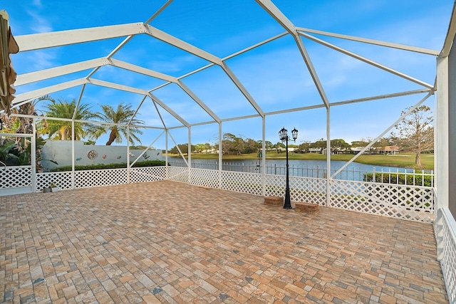 2619 SW Greenwich Way, Palm City, FL 34990 - view of swimming pool featuring a water view, glass enclosure, and a patio
