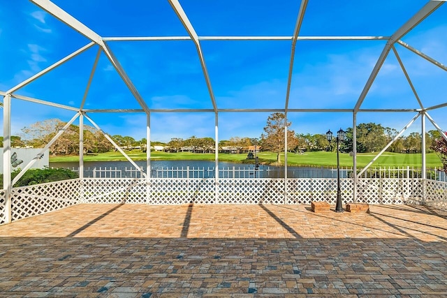 2619 SW Greenwich Way, Palm City, FL 34990 - view of patio featuring a lanai and a water view