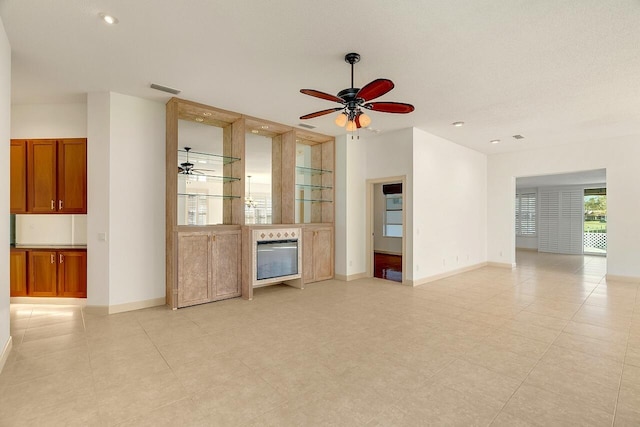 2619 SW Greenwich Way, Palm City, FL 34990 - unfurnished living room with ceiling fan and recessed lighting