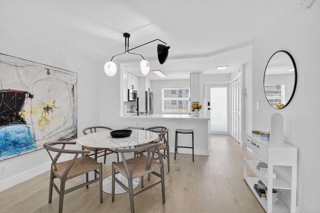 930 Dogwood Dr Unit 358, Delray Beach, FL 33483 - dining room featuring light wood finished floors and baseboards