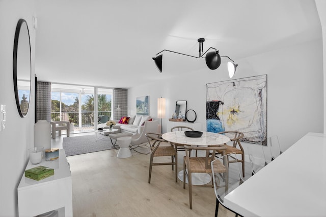 930 Dogwood Dr Unit 358, Delray Beach, FL 33483 - dining space with expansive windows and light wood-style floors