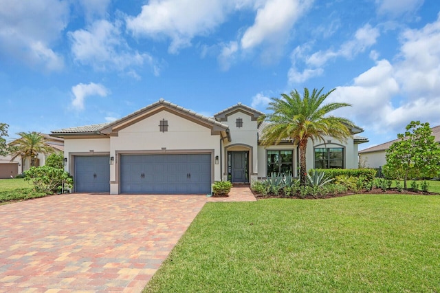 9109 Balsamo Dr, Palm Beach Gardens, FL 33412 - mediterranean / spanish home featuring decorative driveway, a front lawn, stucco siding, an attached garage, and a tiled roof