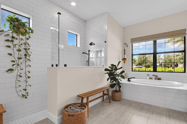 9109 Balsamo Dr, Palm Beach Gardens, FL 33412 - bathroom with a walk in shower, a bath, and tile patterned floors