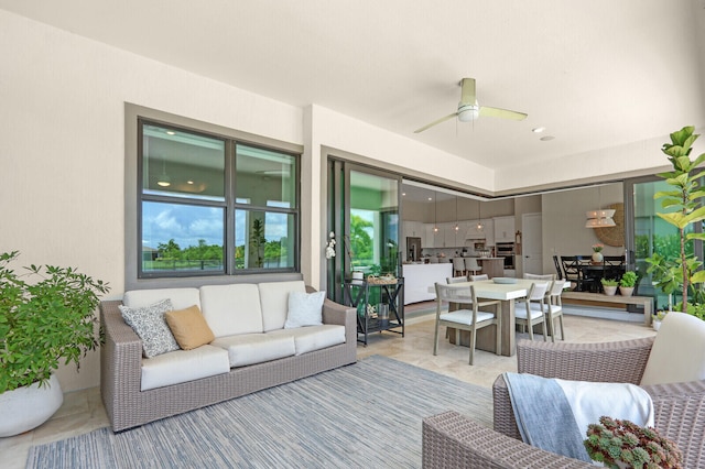 9109 Balsamo Dr, Palm Beach Gardens, FL 33412 - living room with a ceiling fan, light tile patterned flooring, and healthy amount of natural light