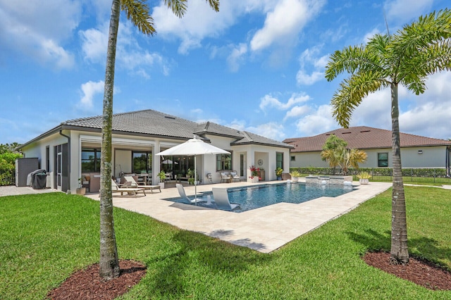 9109 Balsamo Dr, Palm Beach Gardens, FL 33412 - outdoor pool with a patio and a yard