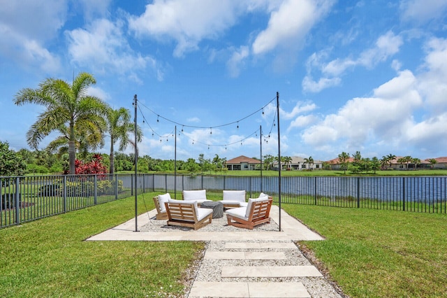 9109 Balsamo Dr, Palm Beach Gardens, FL 33412 - fenced backyard with outdoor lounge area, a patio area, and a water view