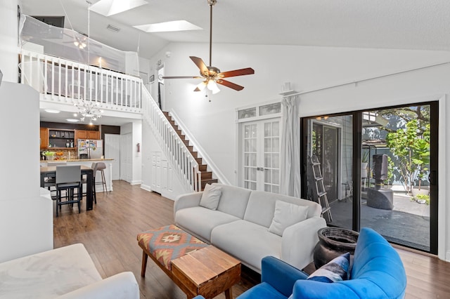 1864 Adventure Pl Unit 1864, North Lauderdale, FL 33068 - living room featuring wood finished floors, high vaulted ceiling, a ceiling fan, french doors, and a skylight