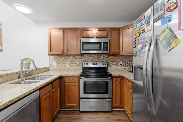 1864 Adventure Pl Unit 1864, North Lauderdale, FL 33068 - kitchen with stainless steel appliances, dark wood-style flooring, brown cabinets, and light stone countertops