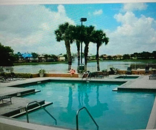 866 NW 92nd Ave, Plantation, FL 33324 - community pool featuring a patio and a water view