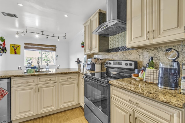 866 NW 92nd Ave, Plantation, FL 33324 - kitchen with wall chimney range hood, stainless steel appliances, cream cabinetry, ornamental molding, and recessed lighting