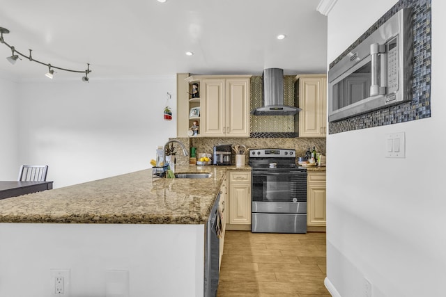 866 NW 92nd Ave, Plantation, FL 33324 - kitchen with stainless steel appliances, wall chimney exhaust hood, a peninsula, cream cabinets, and backsplash