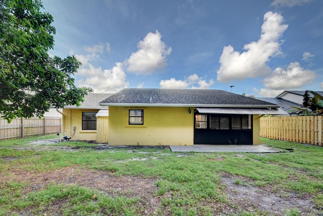6170 Serene Run, Lake Worth, FL 33463 - back of property featuring stucco siding, a fenced backyard, a shingled roof, a patio, and a sunroom