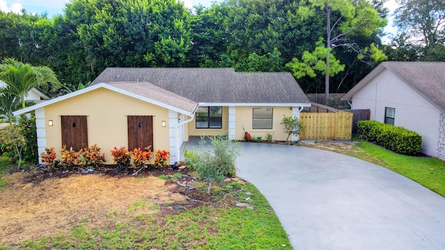 6170 Serene Run, Lake Worth, FL 33463 - view of front of house with concrete driveway, stucco siding, and roof with shingles