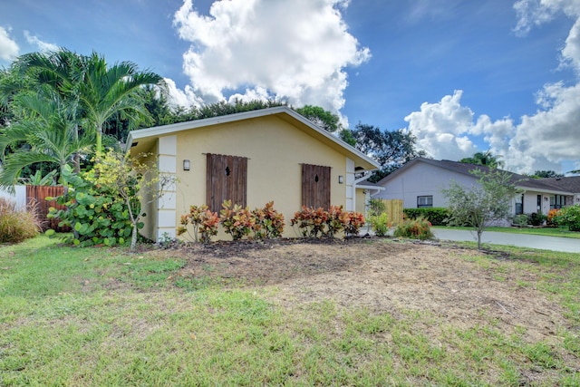 6170 Serene Run, Lake Worth, FL 33463 - view of front facade with stucco siding, a front yard, and driveway